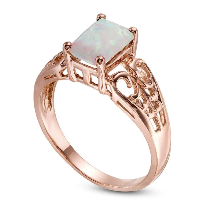 Rings EmeraldCut LabCreated Opal Open Scroll Ring in Solid 10K Rose Gold Goldia Rings EmeraldCut LabCreated Opal Open Scroll Ring in Solid 10K Rose Gold Goldia